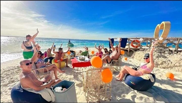 Guests relaxing on the beach at Magawish Island