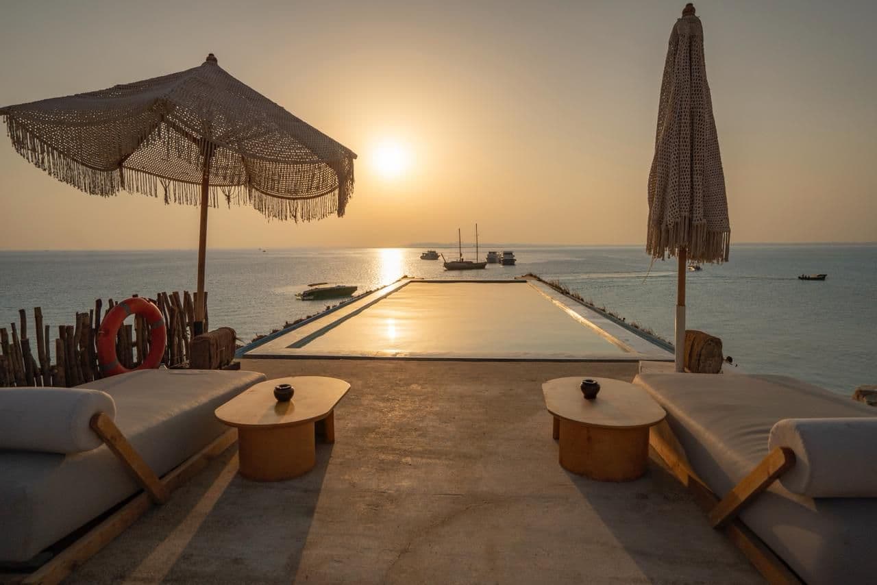 Pool and lounge area at sunset, Ozirea Island
